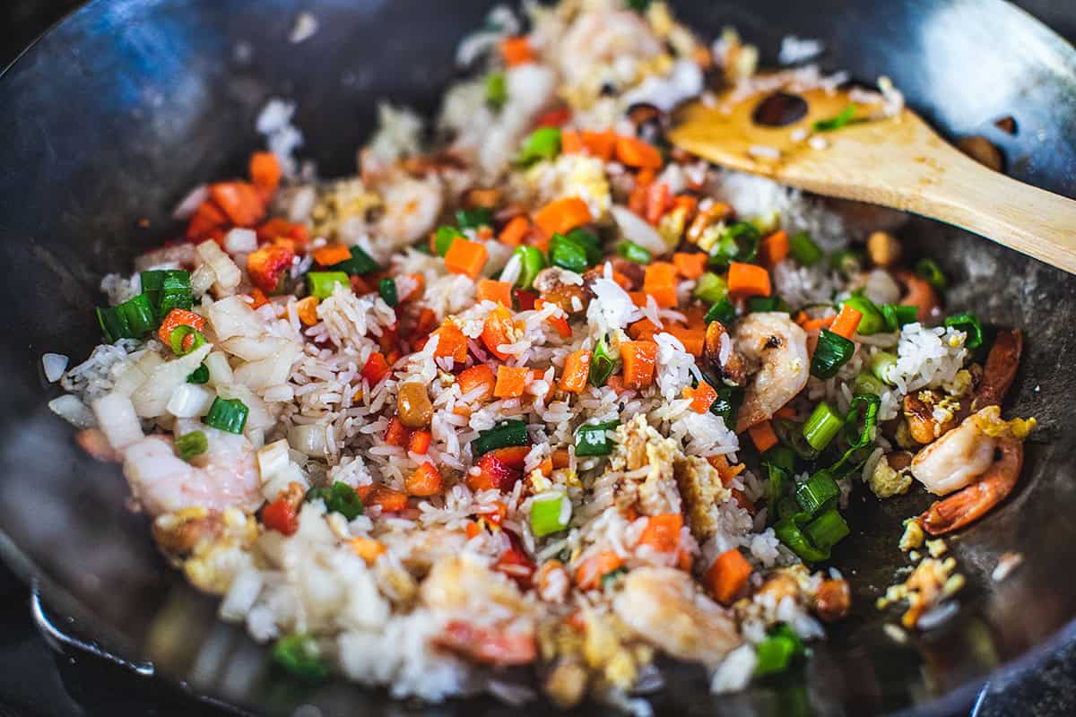 fried vegetables in a wok for shrimp pineapple fried rice.  