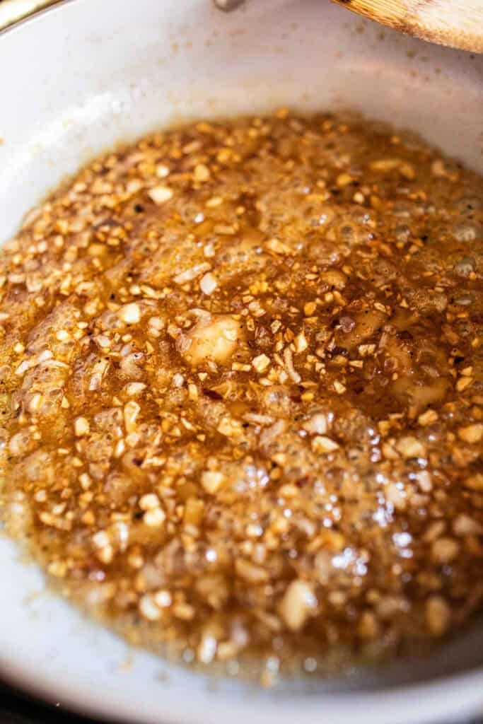 Thai tamarind sauce in a pan on the stove. 