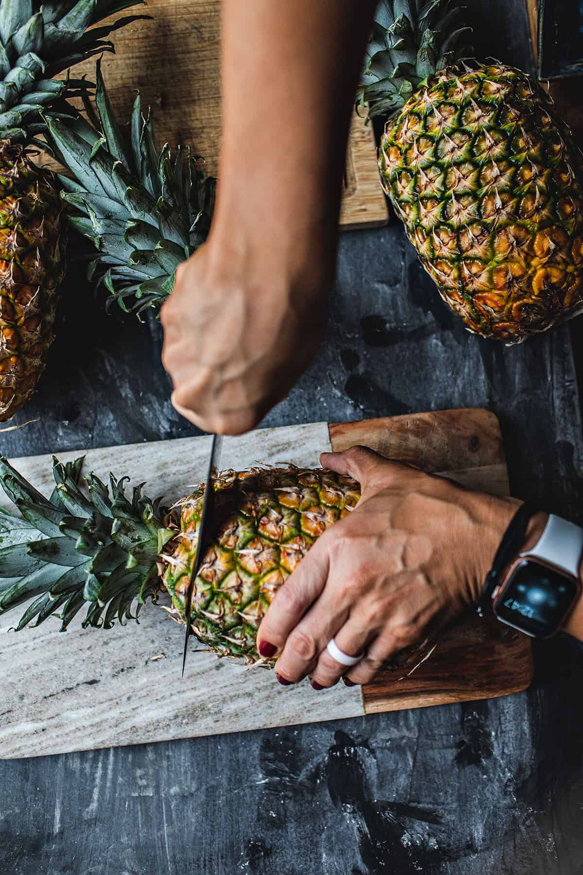 cutting pineapple with a knife 