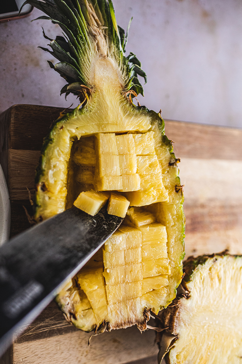 pineapple bowls on cutting board.