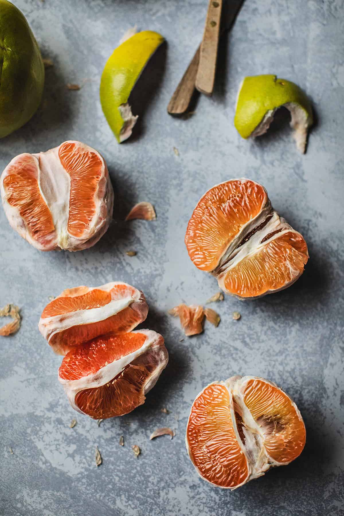 cut pomelo slices on the table.