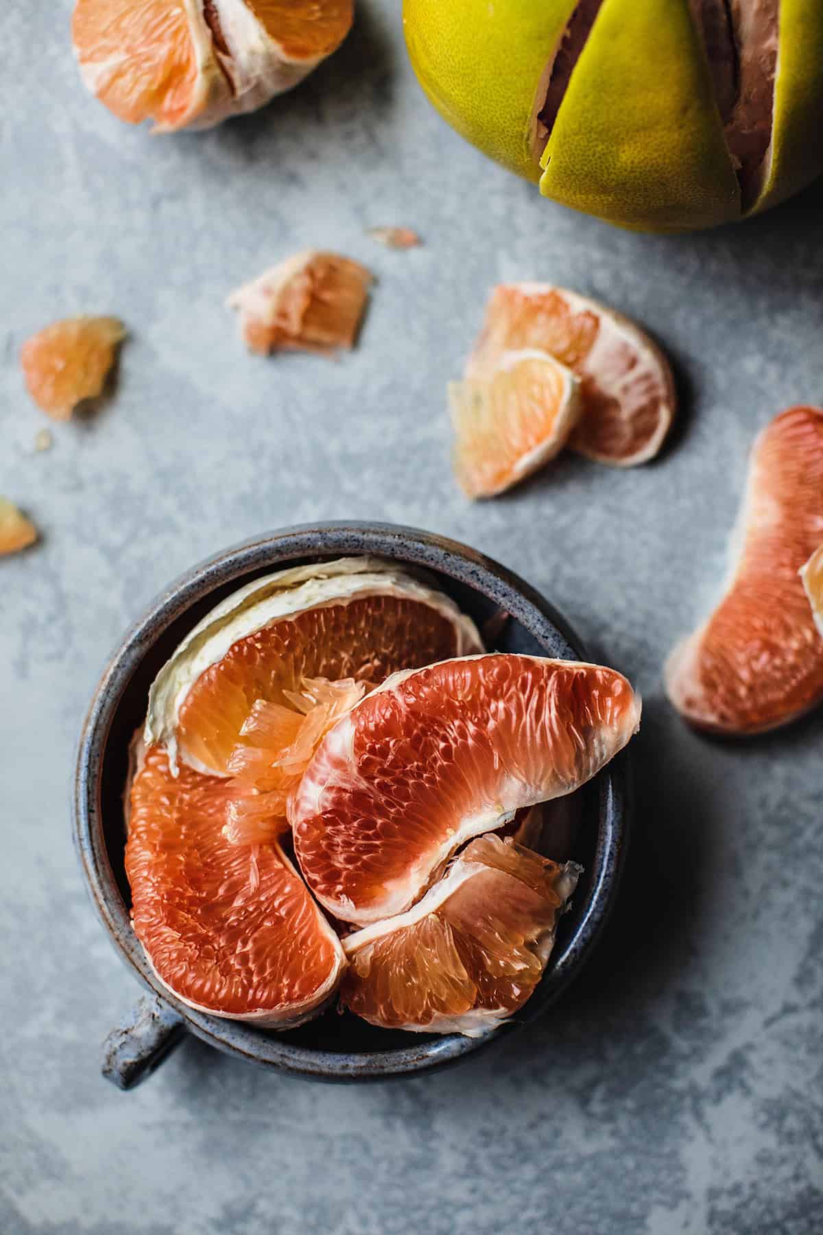 Pomelo slices in a bowl.