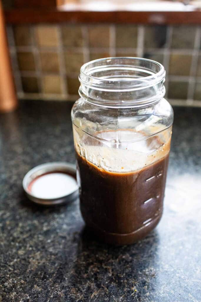 Tamarind concentrate in a mason jar.