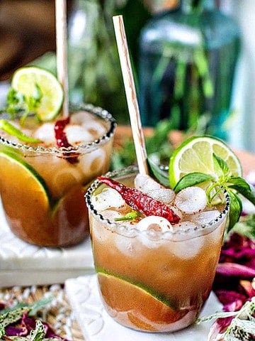 Spicy tamarind cocktail with Smirnoff Vodka on table.