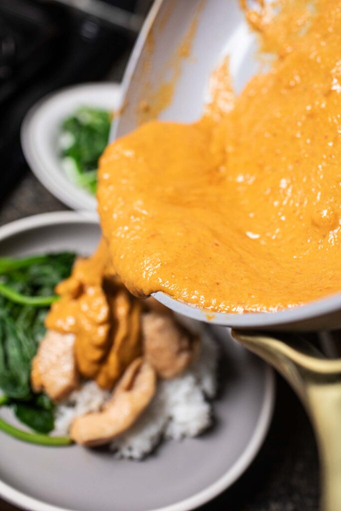 rama curry sauce pouring from a skillet.