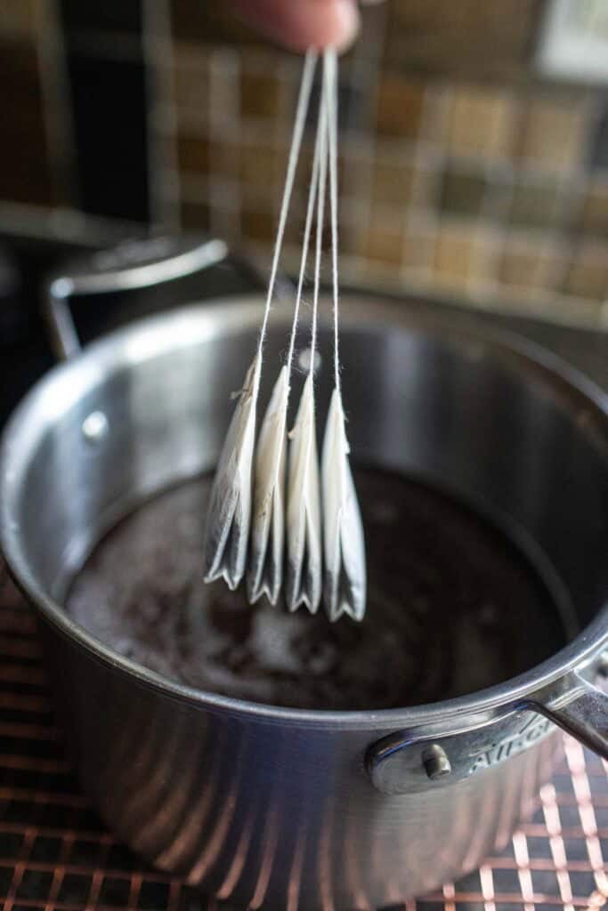 4 Tea bags in a stock pot with tamarind paste. 