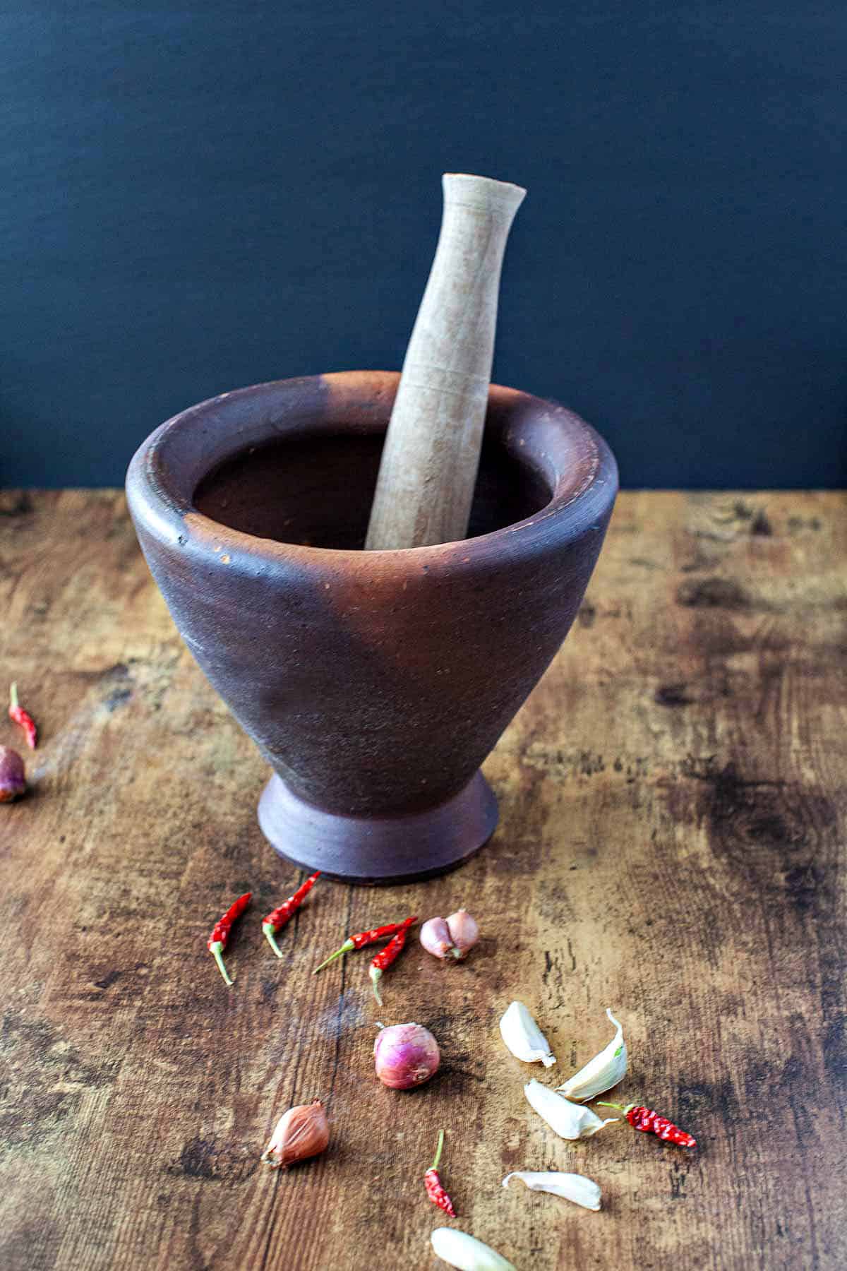 Mortar and pestle set on table.