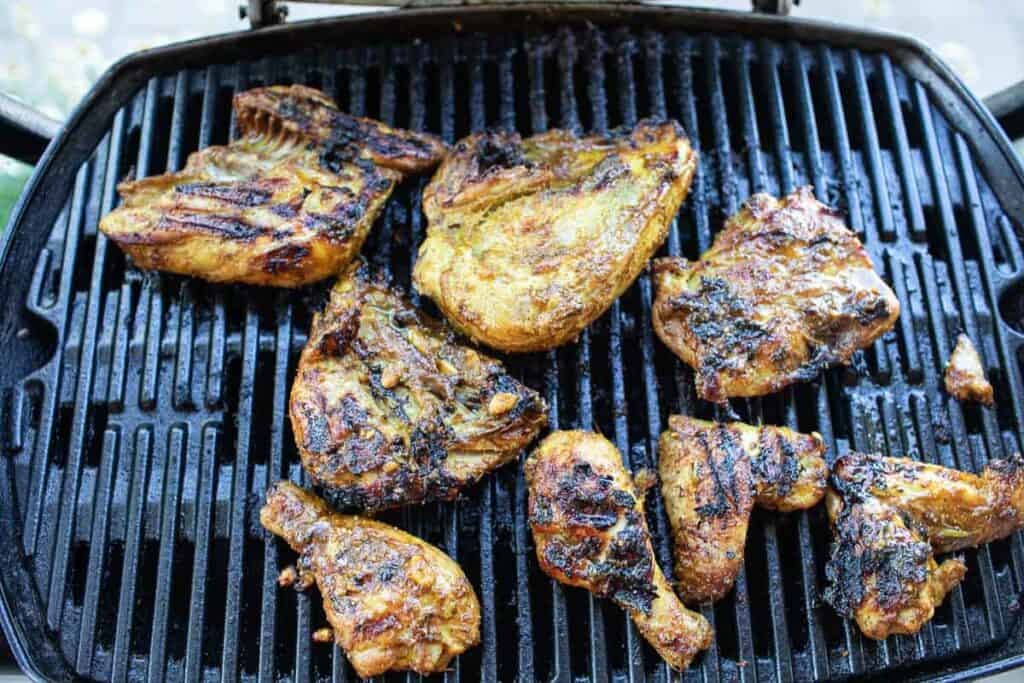 Grilled chicken on a grill. 