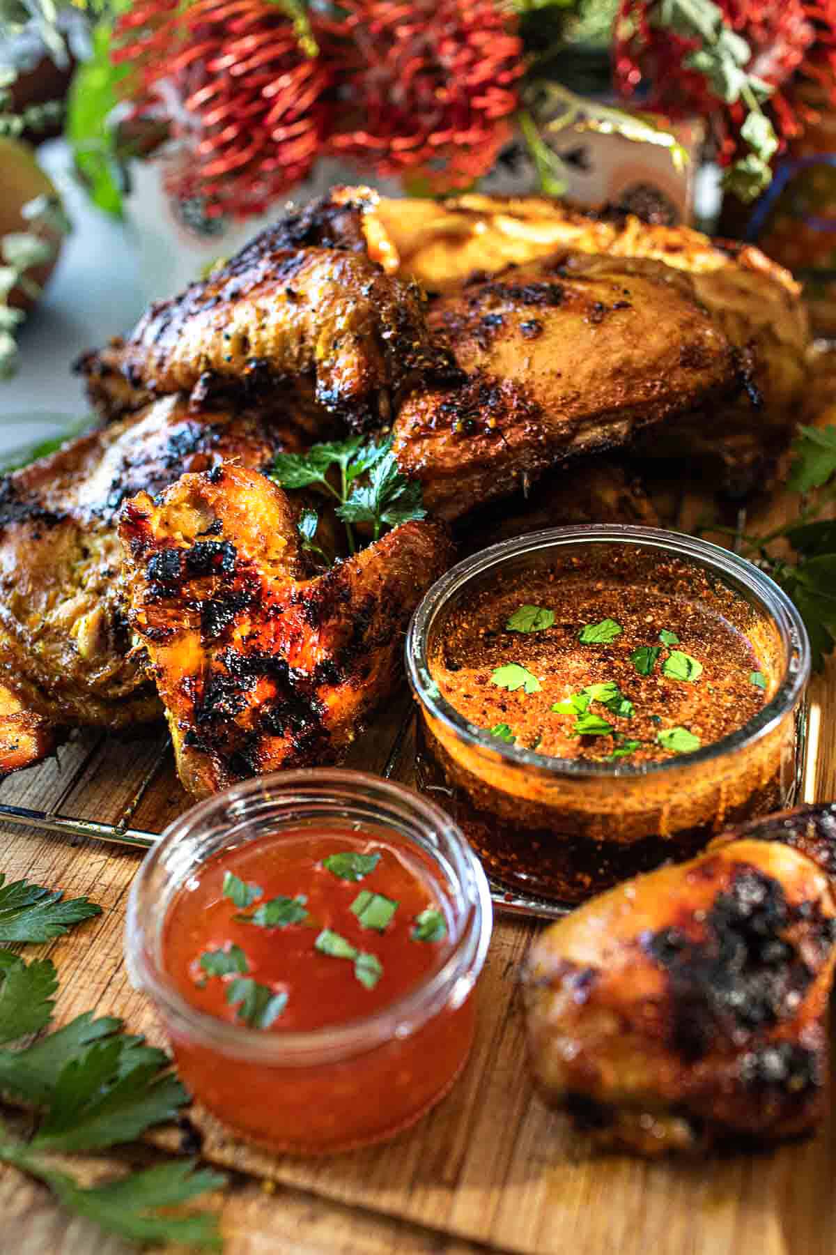 Thai grilled chicken on cutting board. 