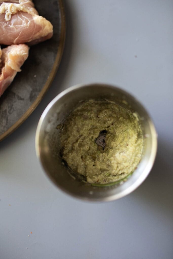 Gai Yang marinating sauce in a spice grinder.