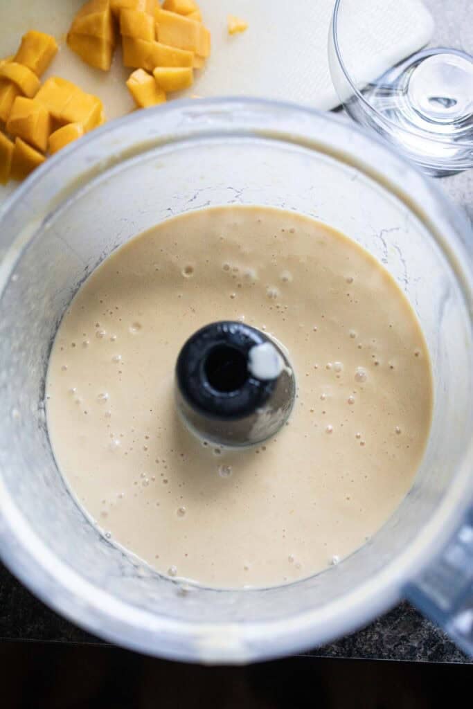 Mango puree in a food processor.