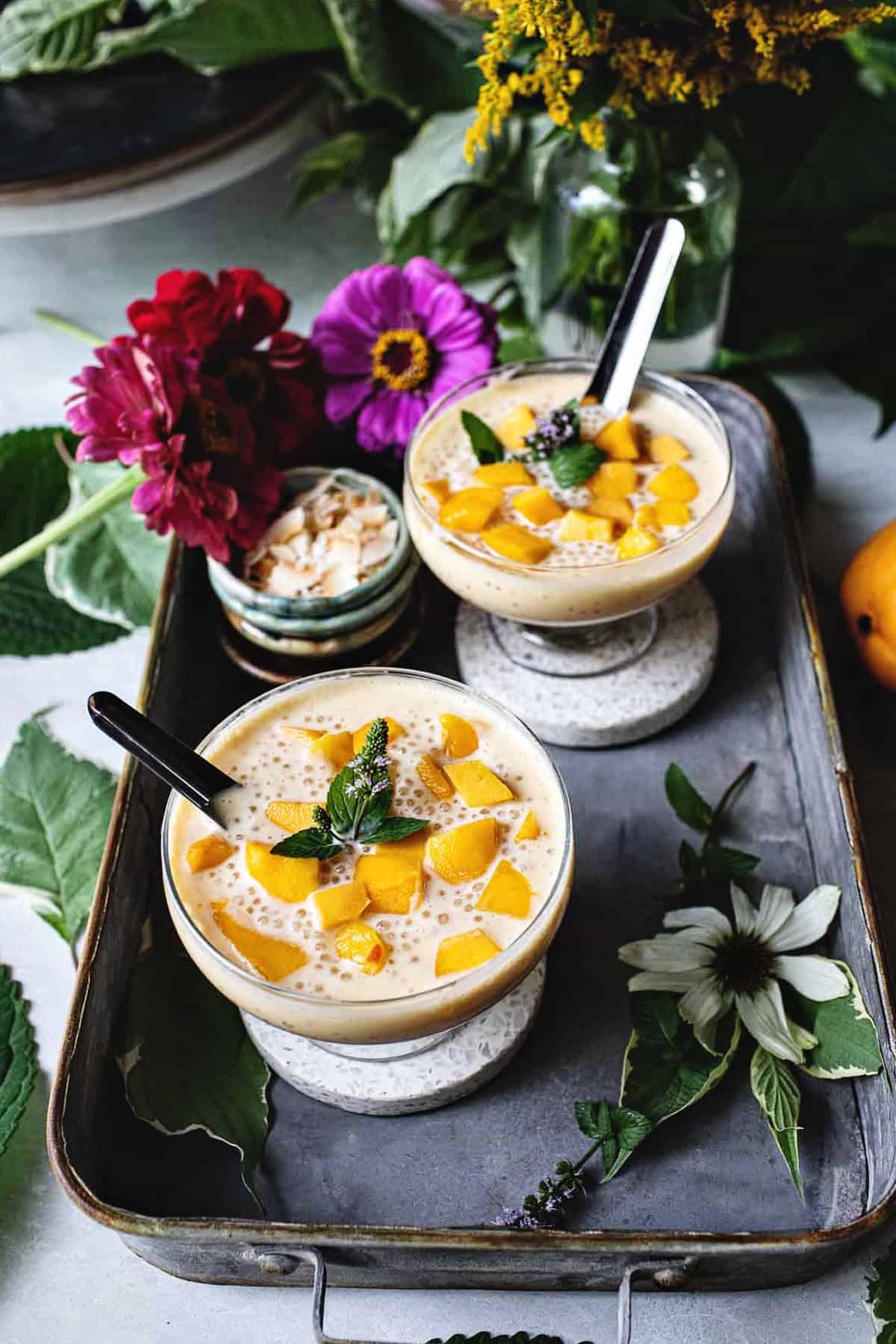 Mango Tapioca Pudding  in glasses on a tray.