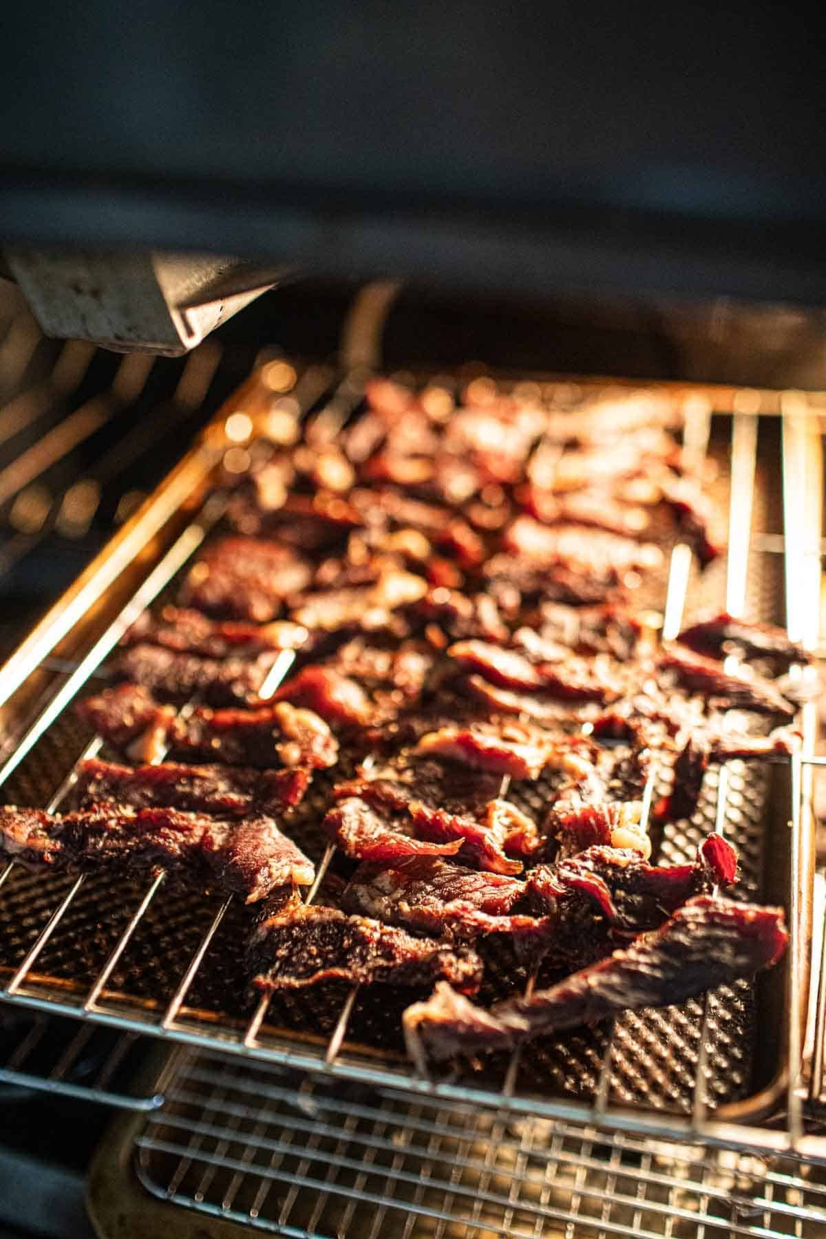 Thai Beef jerky strips in the oven.