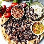 Thai beef jerky on a cutting board.