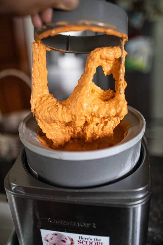 Thai tea ice cream in a machine.