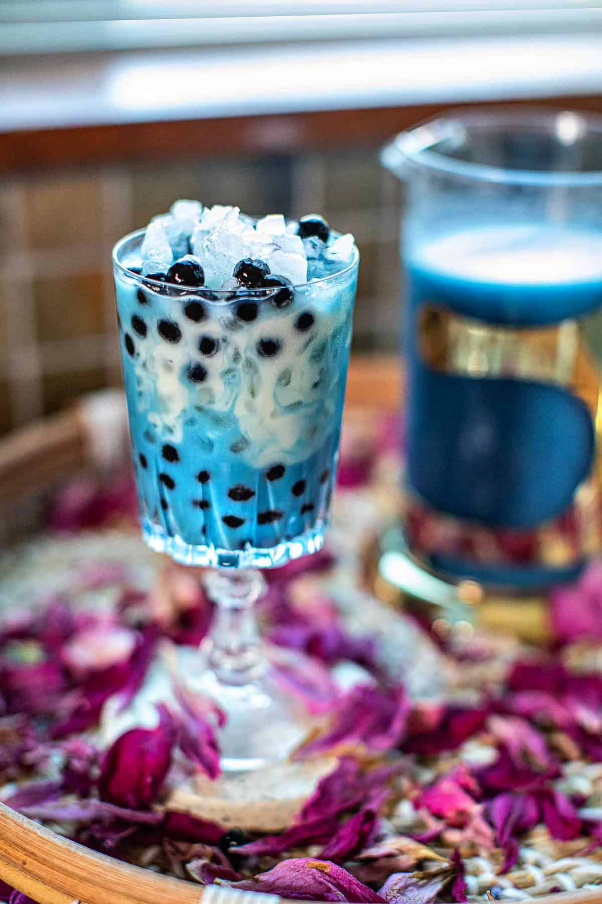 Blue milk tea boba in a glass.