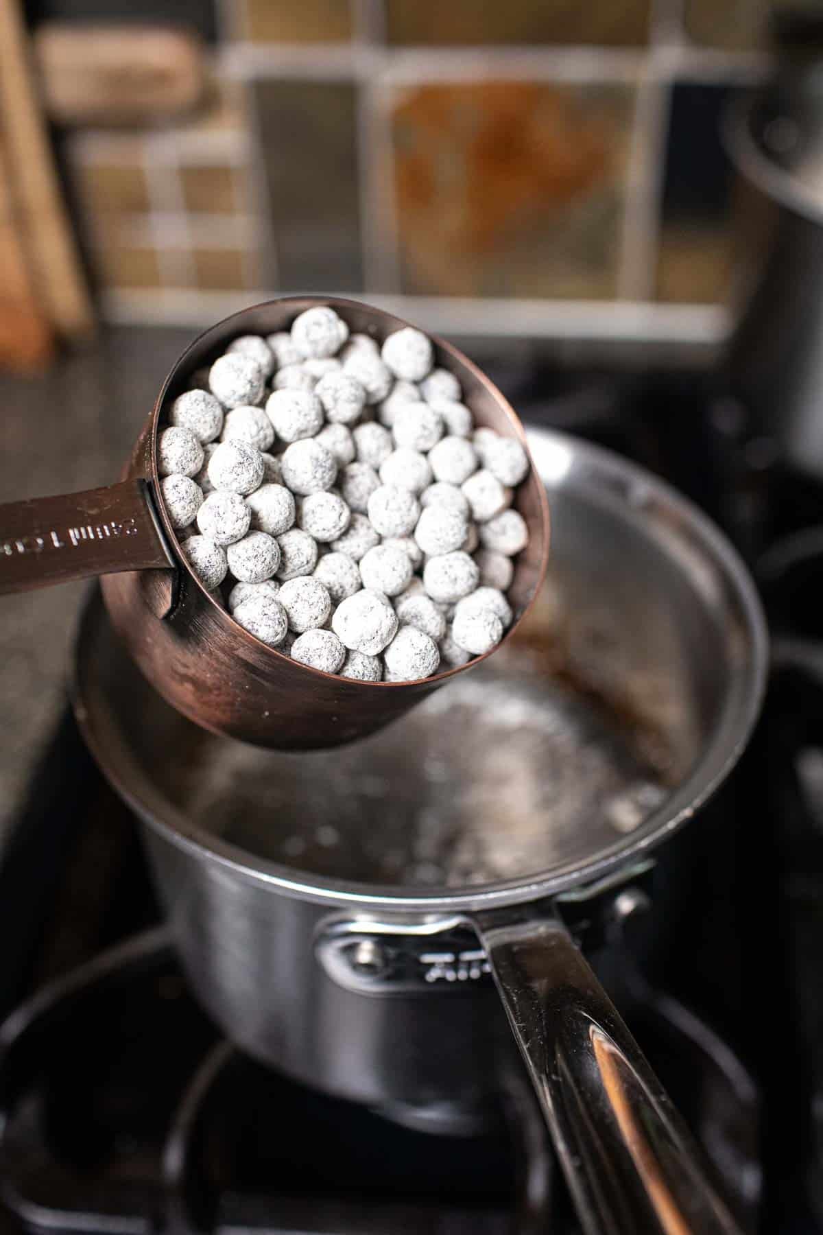 Cooking tapioca pearls in a pot. 