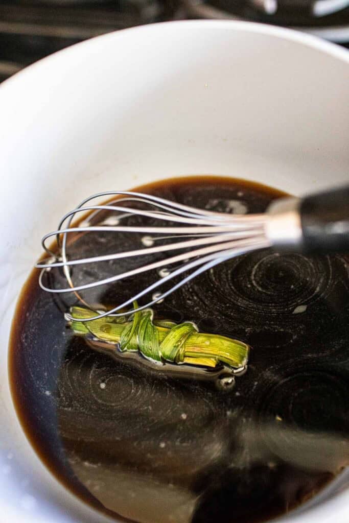 Simply syrup in a pot with pandan leaves. 