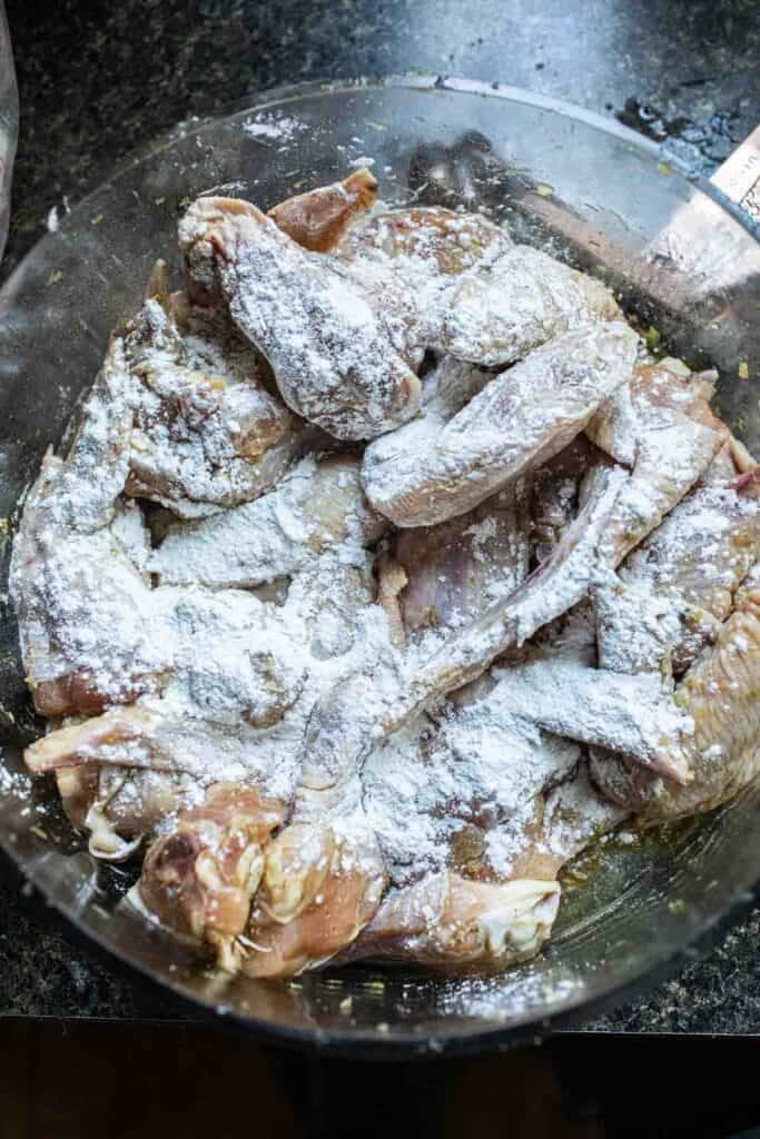 Chicken in rice flour in a bowl.