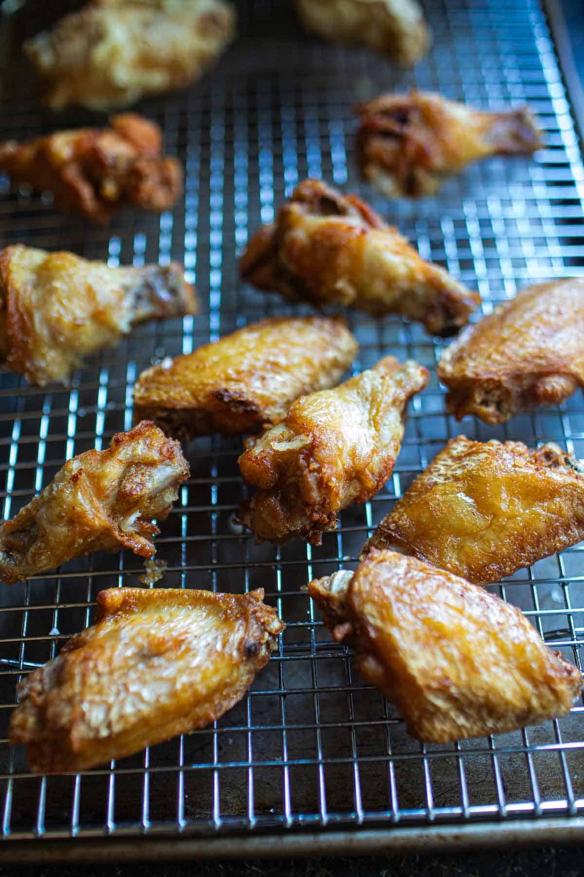 Thai chicken wings on a wire rack.