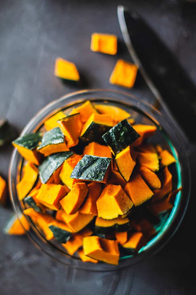 Cut Kabocha squash in a bowl on the table. 