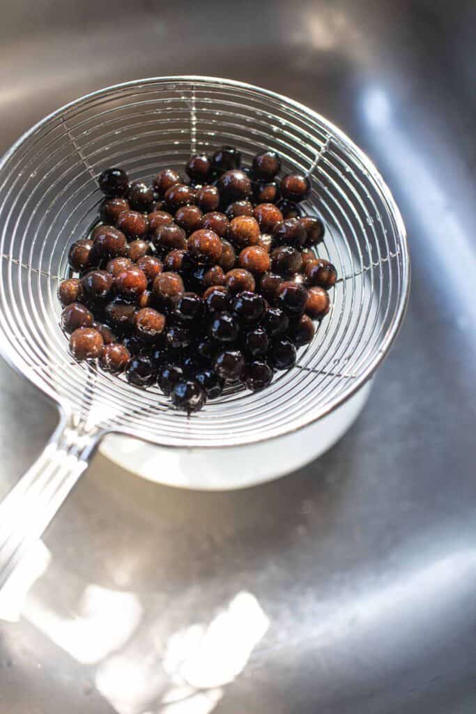 Tapioca pearls in a strainer. 