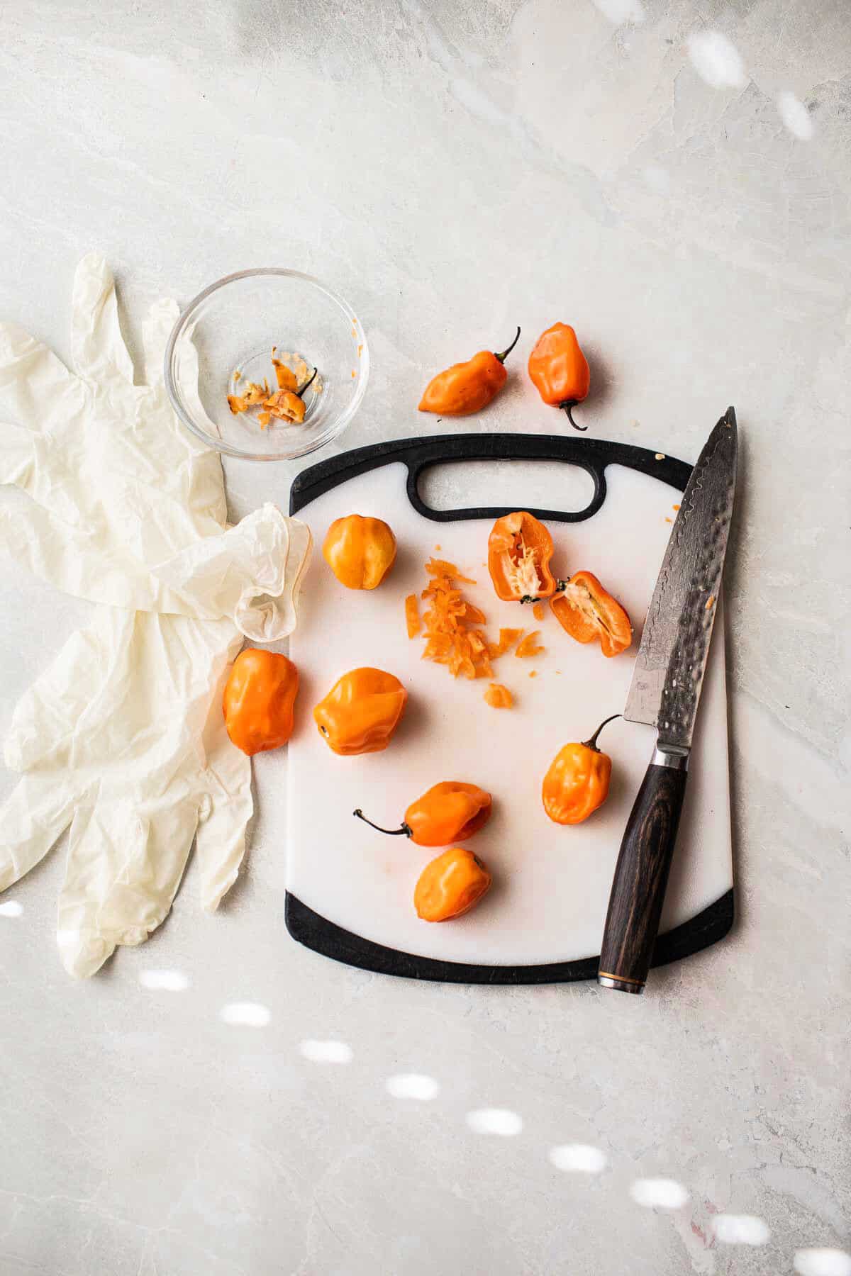 Habanero peppers on a cutting board. 