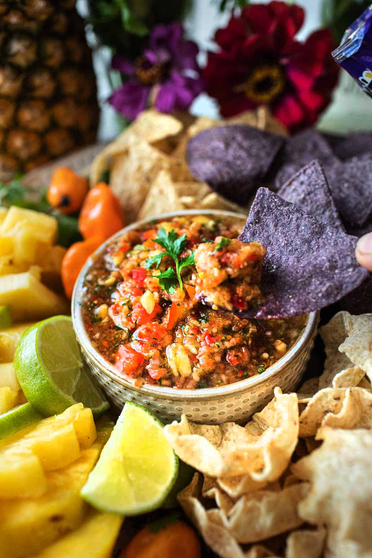 Pineapple salsa in a bowl with chips.