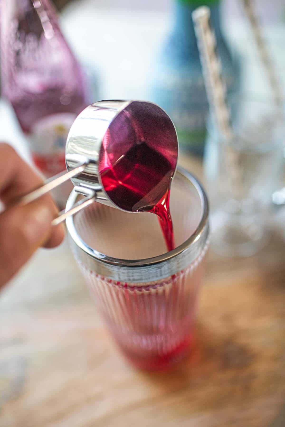 Sala syrup pouring into a glass.