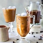 Thai coffee in a glass on the table.