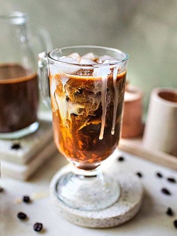 Thai iced coffee in a glass on the table.