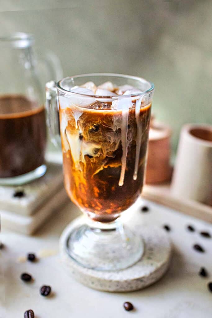 Thai iced coffee in a glass on the table.