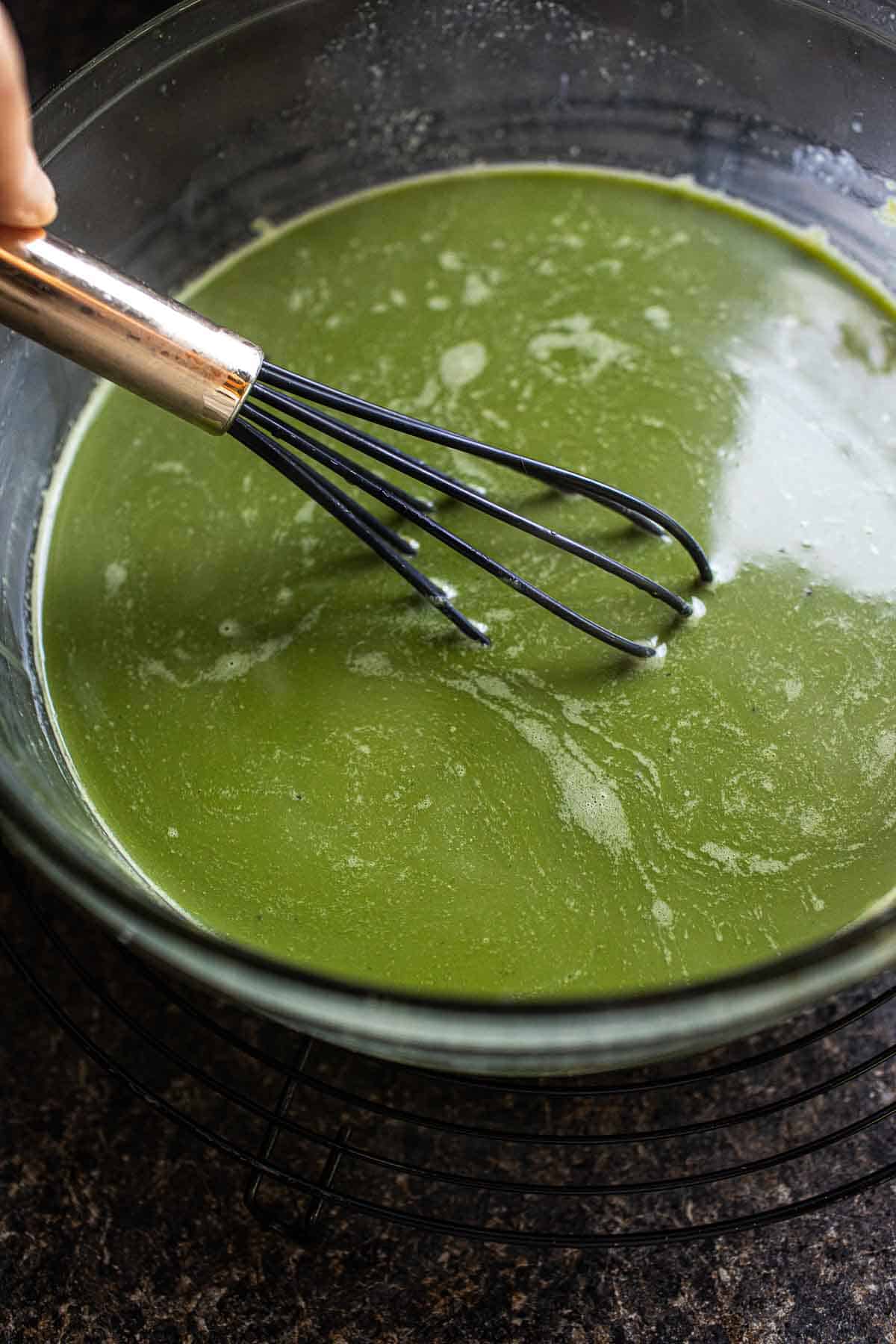 Thai green milk tea in a bowl.