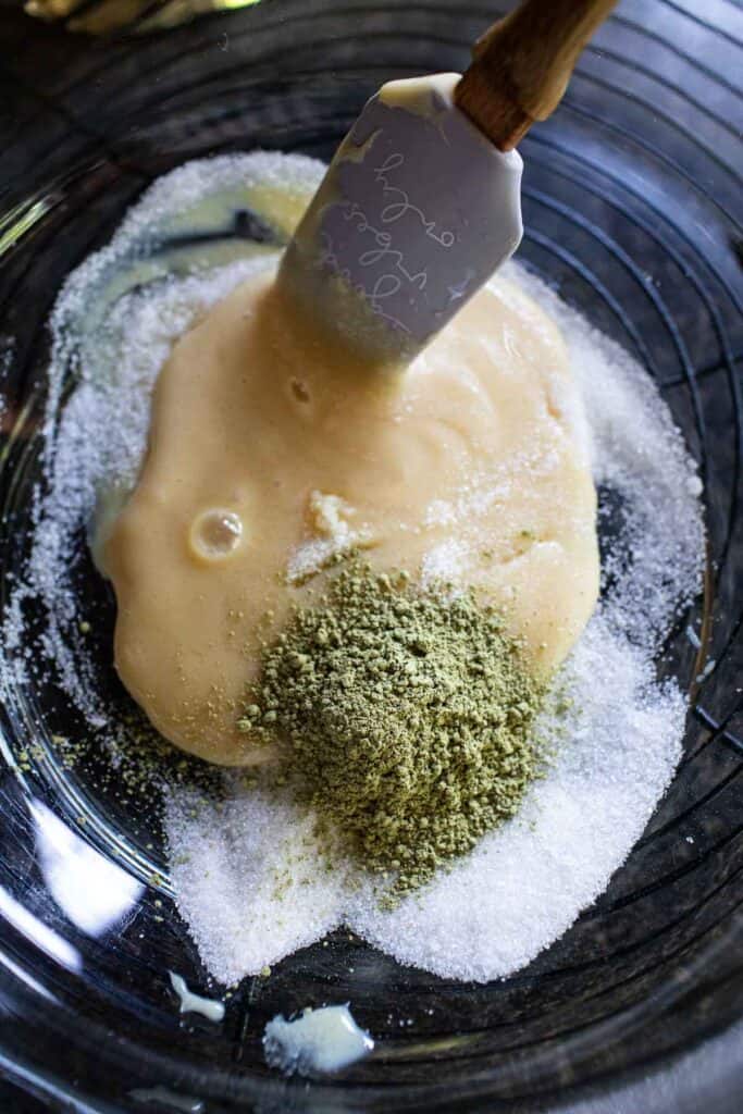 Matcha powder, sugar, salt and condensed milk in a bowl.