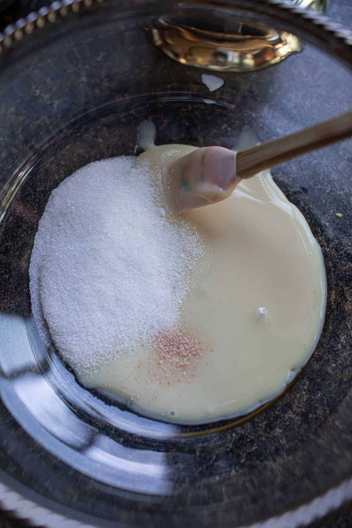 Sugar, salt and condensed milk in a bowl. 