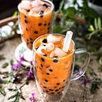 Thai boba tea in two glasses on a tray.