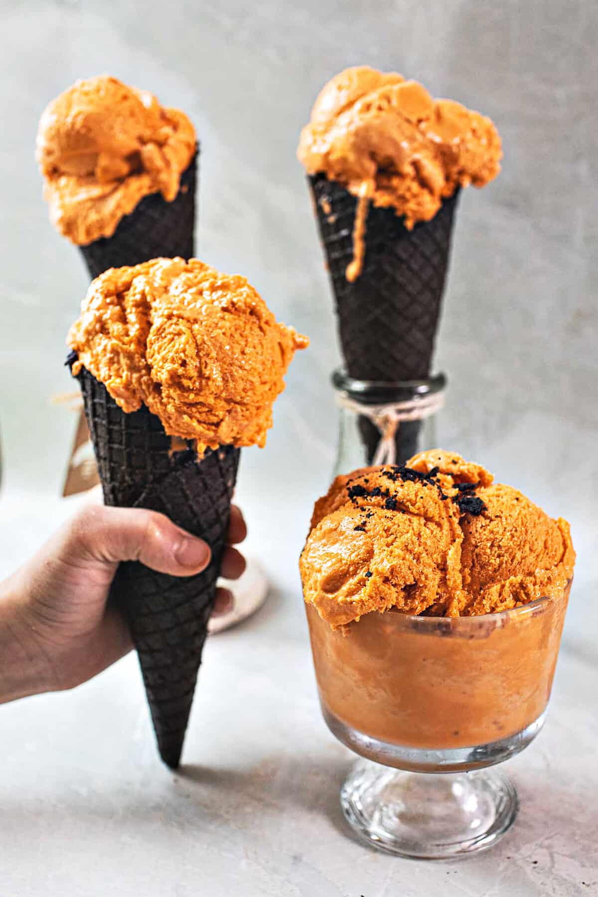 Thai tea ice cream in cones and glass. 