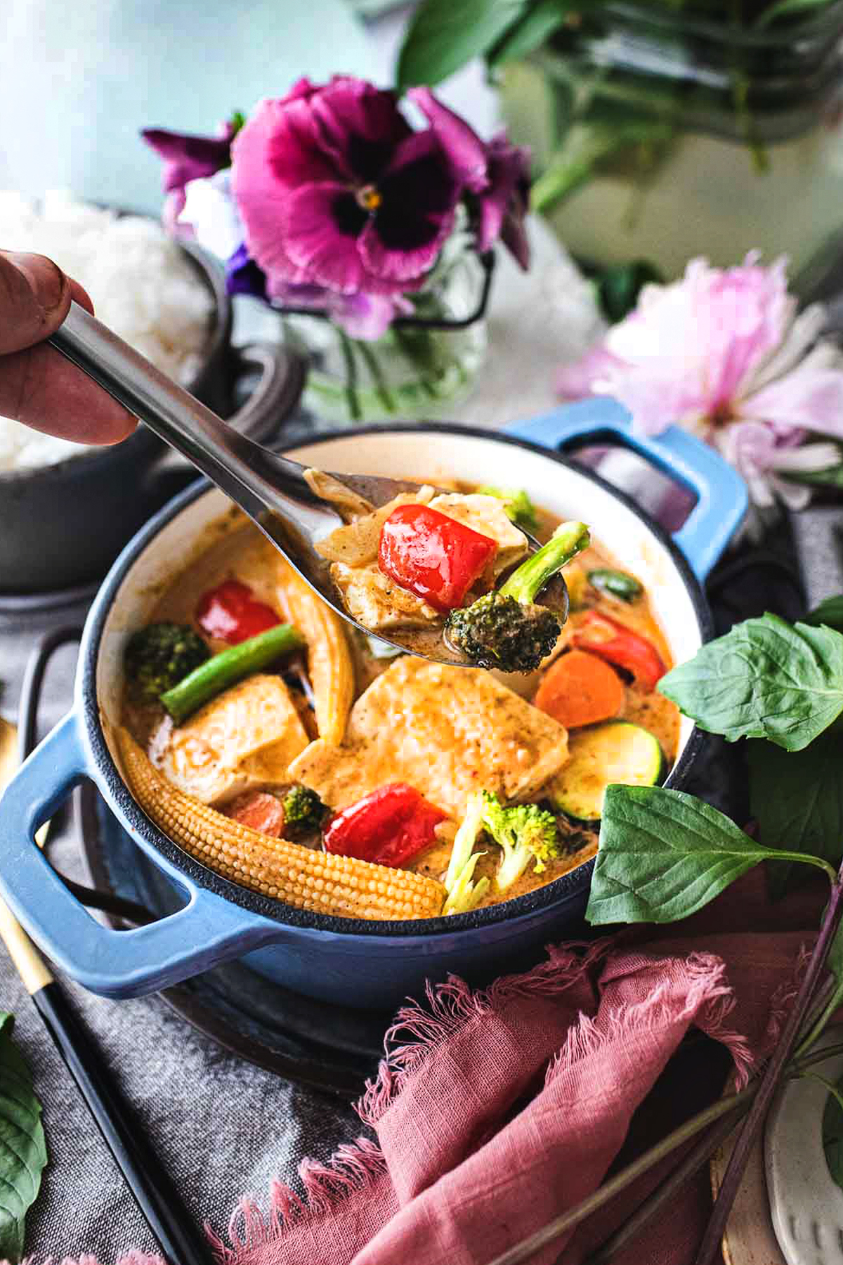 Thai vegetarian yellow curry in a pot on the table. 