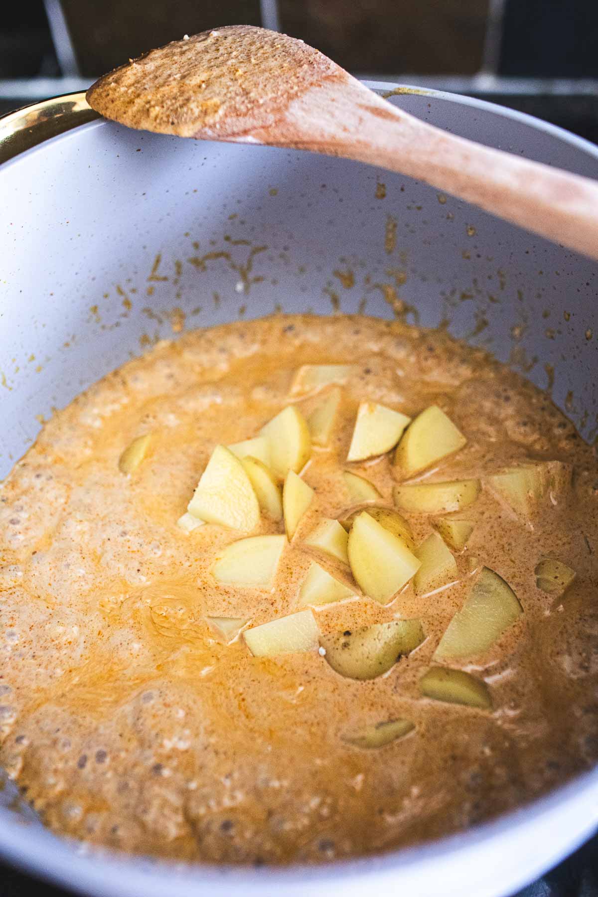 Thai vegetarian yellow curry in a pot. 