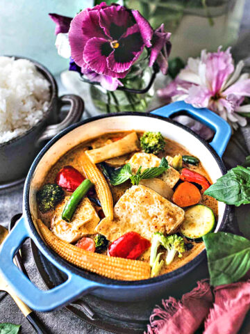 Thai yellow curry vegetarian in a pan on table.