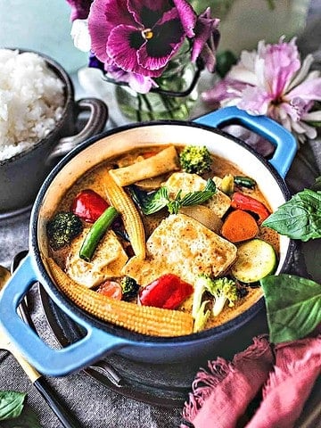 Thai yellow curry vegetarian in a pan on table.