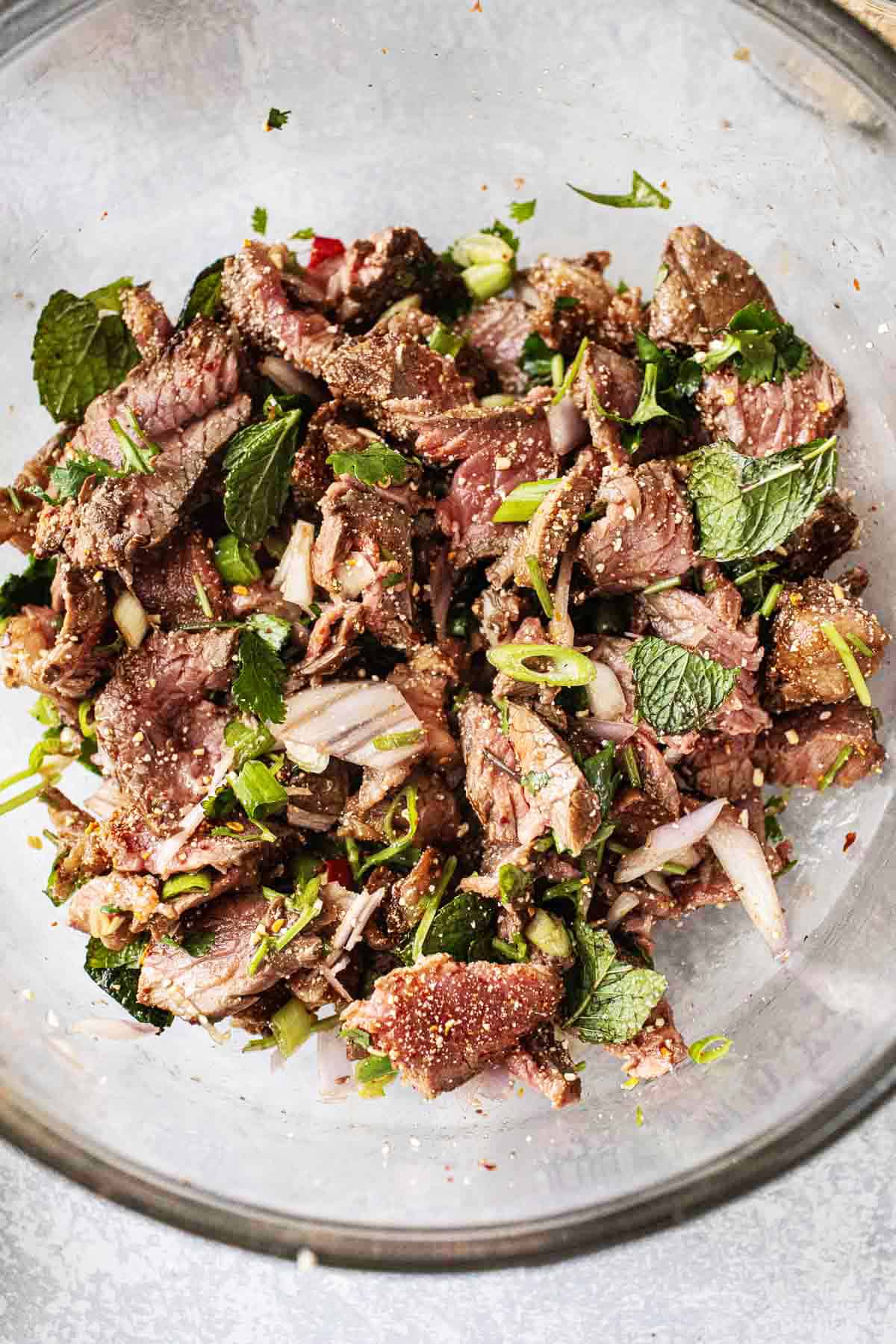 Beef laab in a glass bowl. 