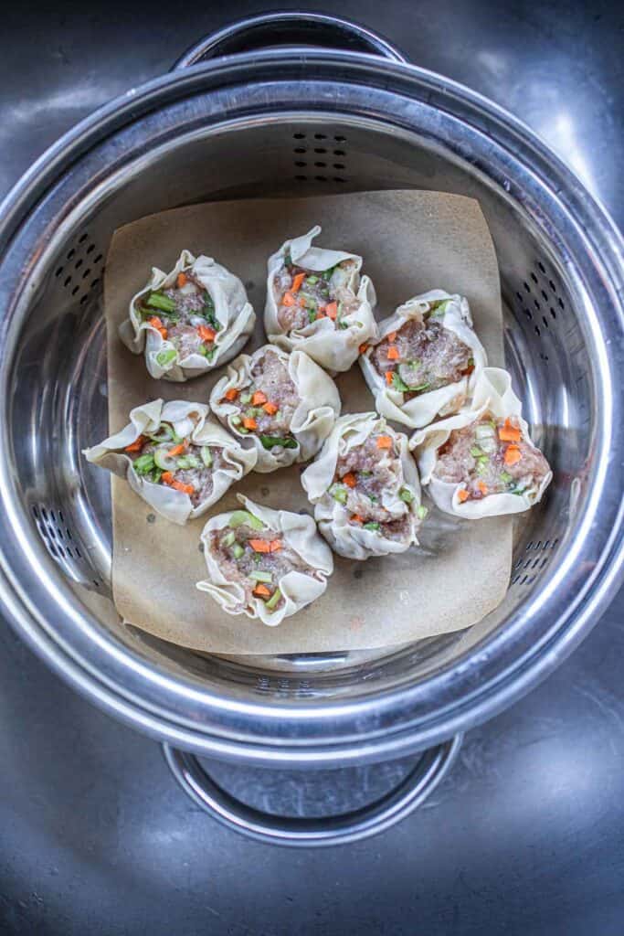 Dumplings inside a pot of steamer. 