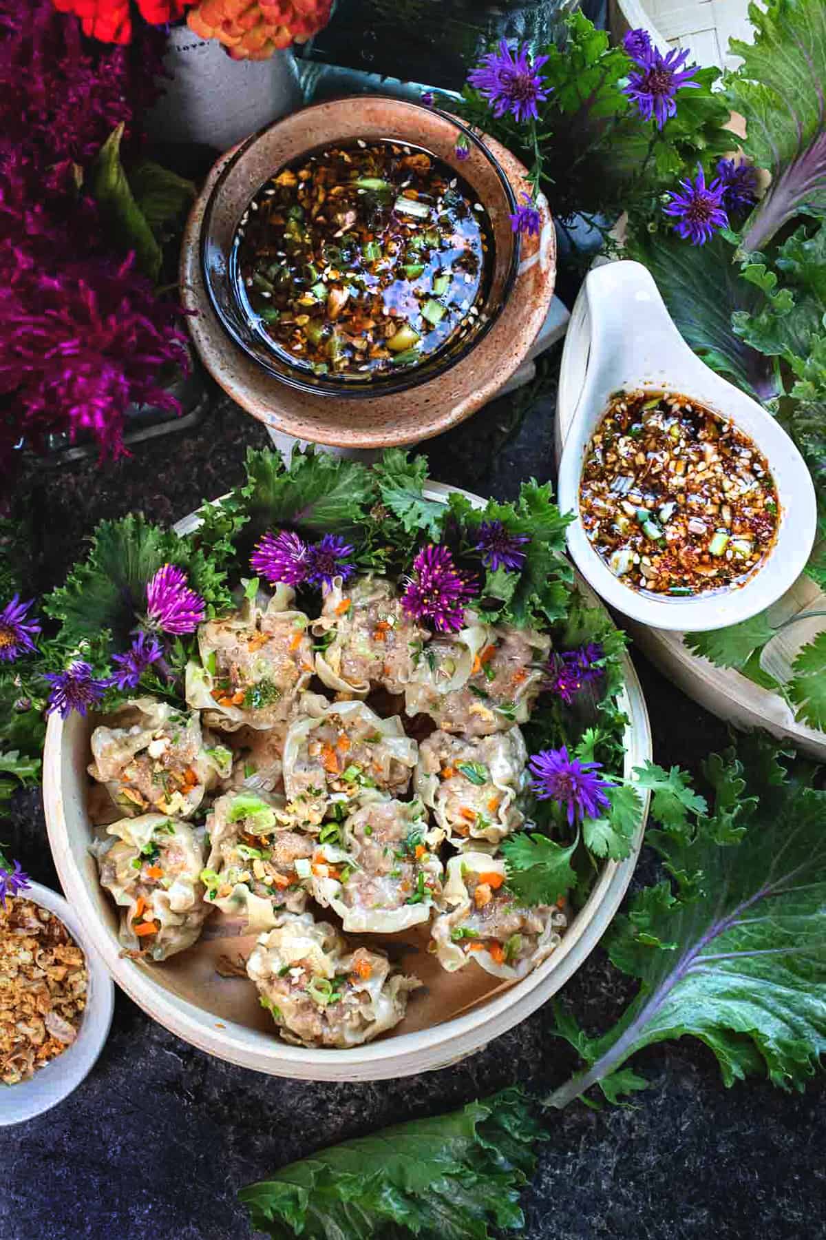 Thai pork and shrimp dumplings on a serving platter. 