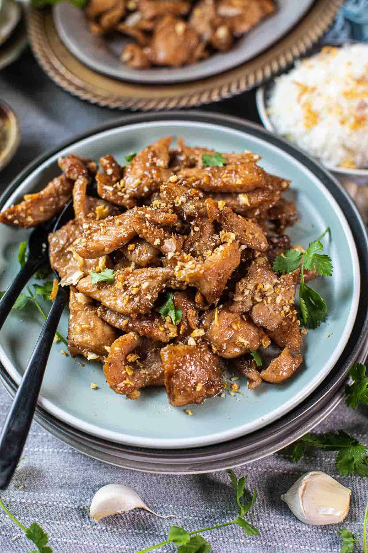 Thai pork garlic pepper with fork and spoon. 