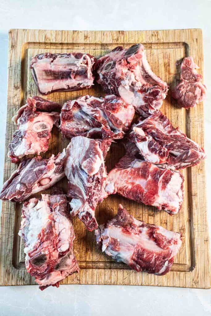 Beef back ribs on a cutting board.