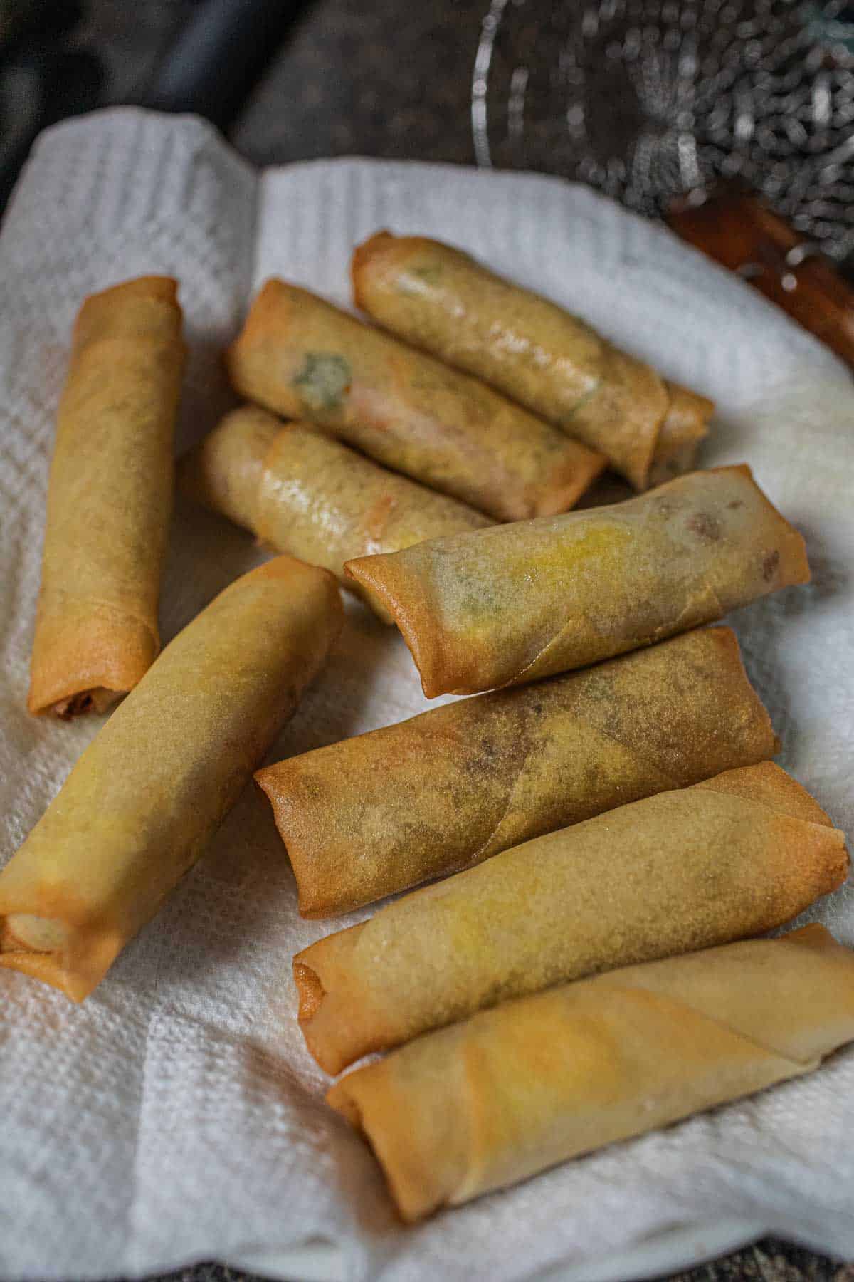 Egg rolls on a paper towel.