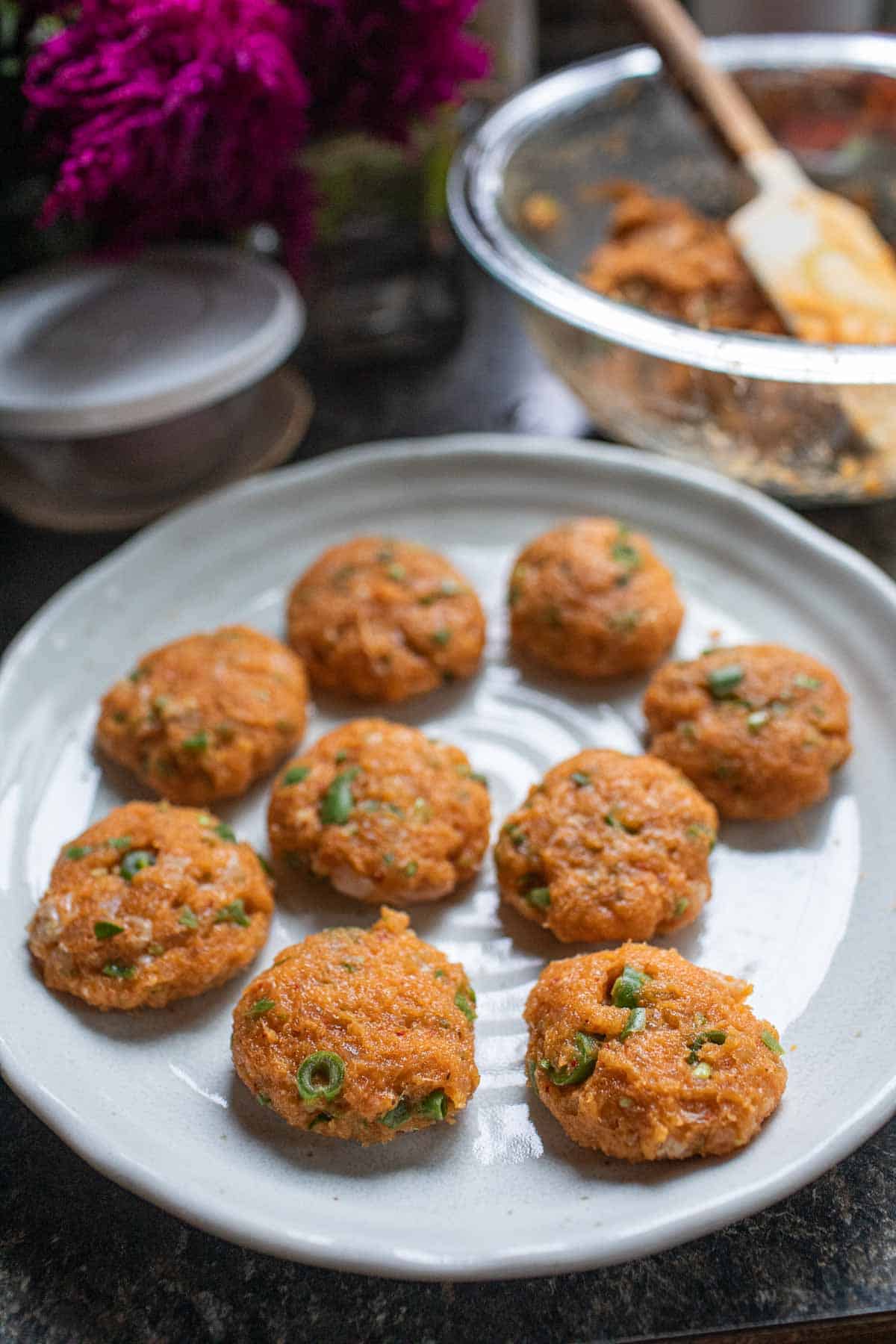 Thai fish cake patties on a plate.