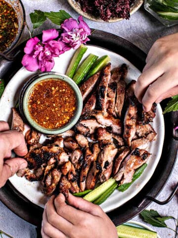 Moo Yang grilled pork slices on a platter.