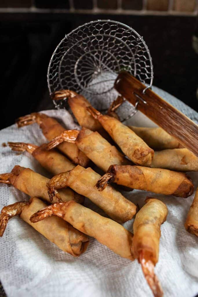 Shrimp rolls on a paper towel lined plate. 